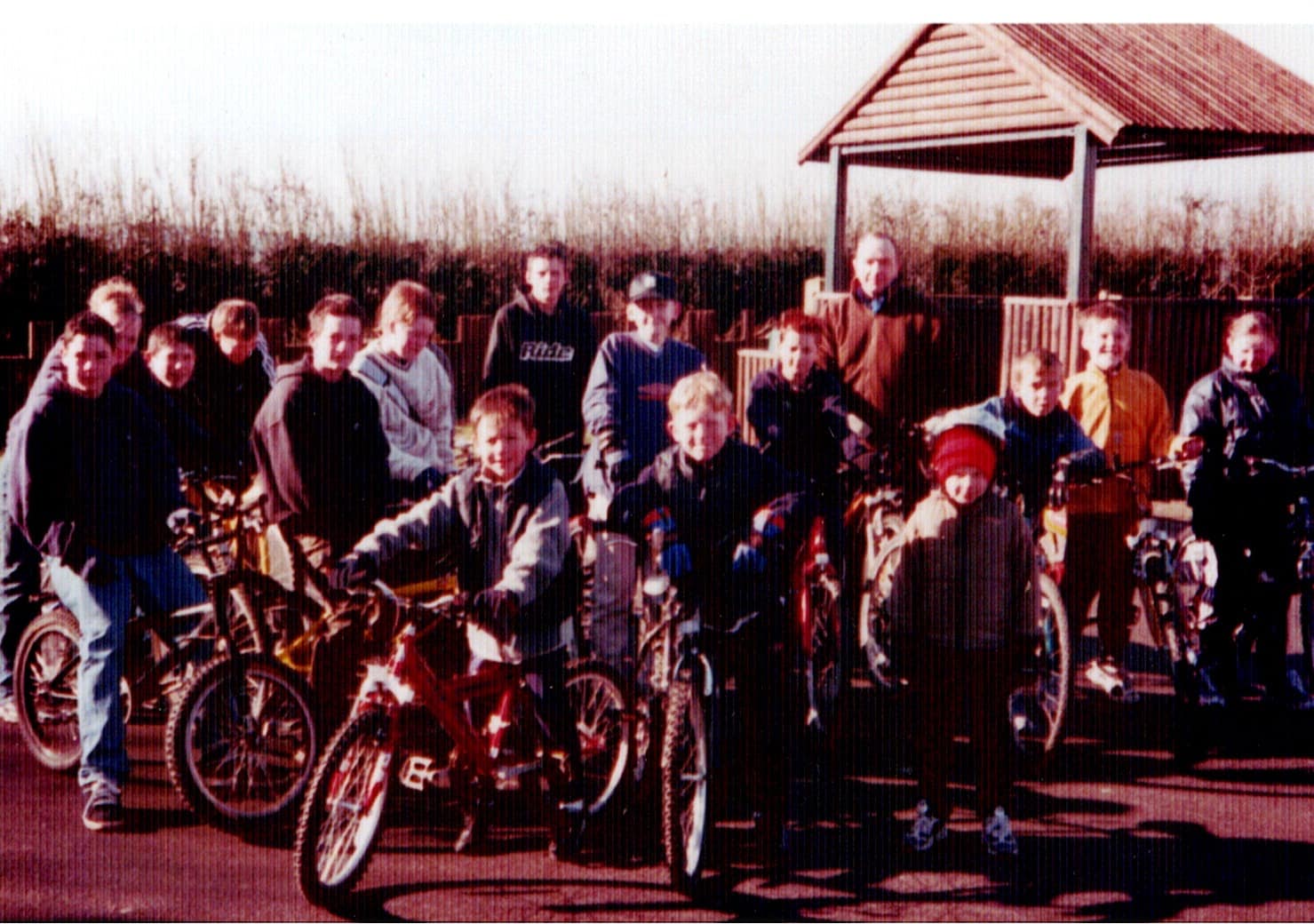 Villagers with their bikes gathered by the shelter for a sponsored bike ride