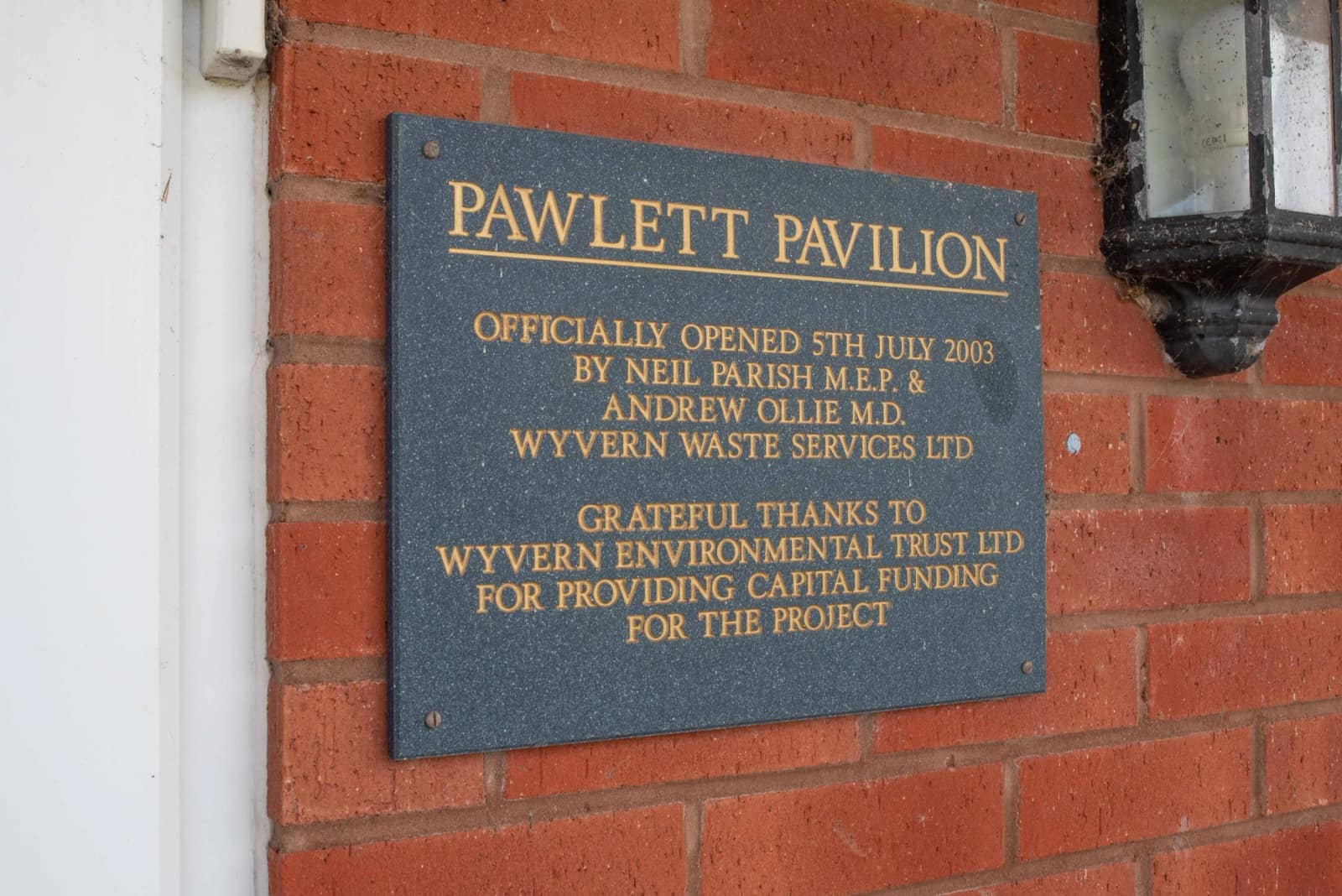 The opening plaque on the clubhouse wall
