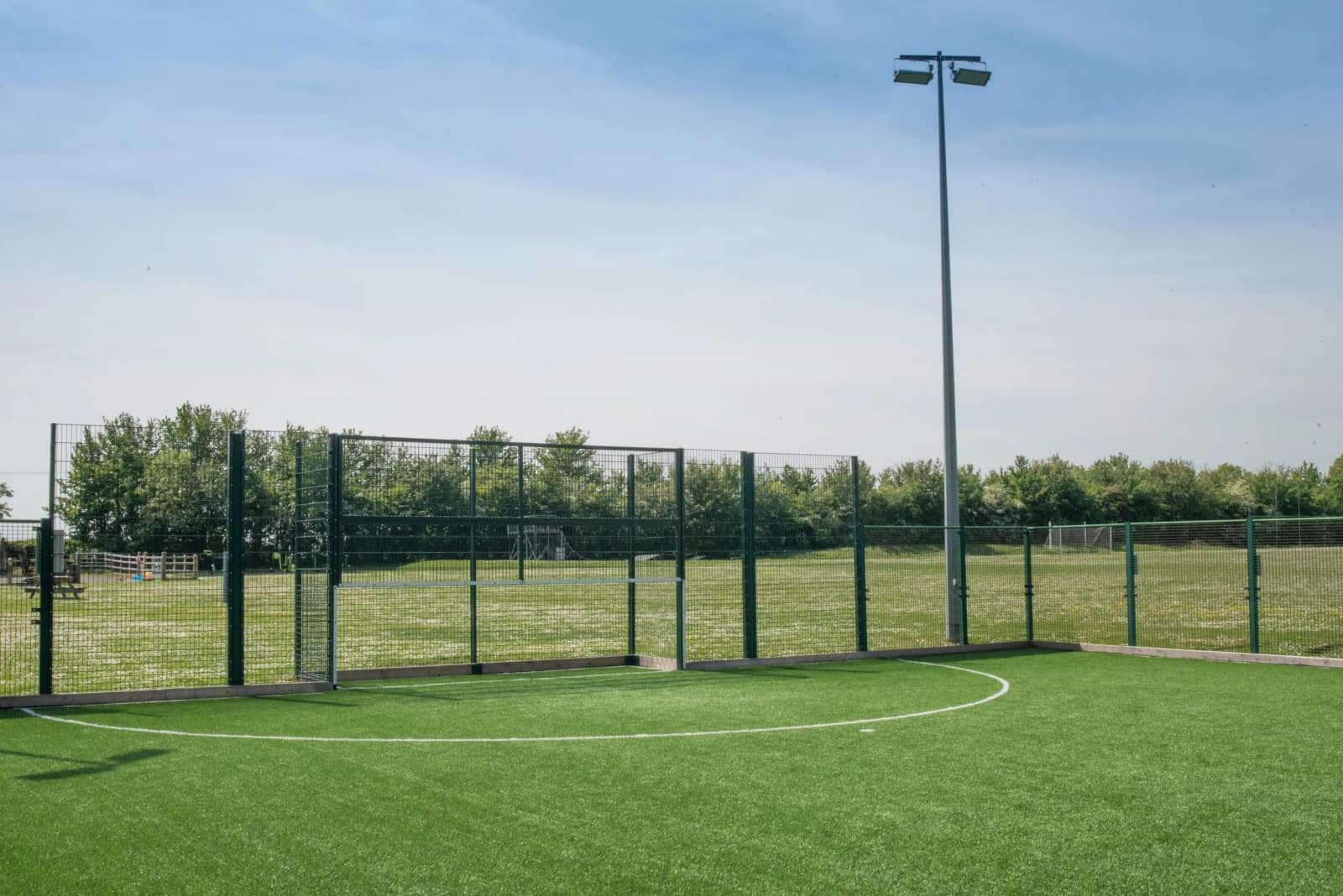 A corner of the 3G pitch with a floodlight